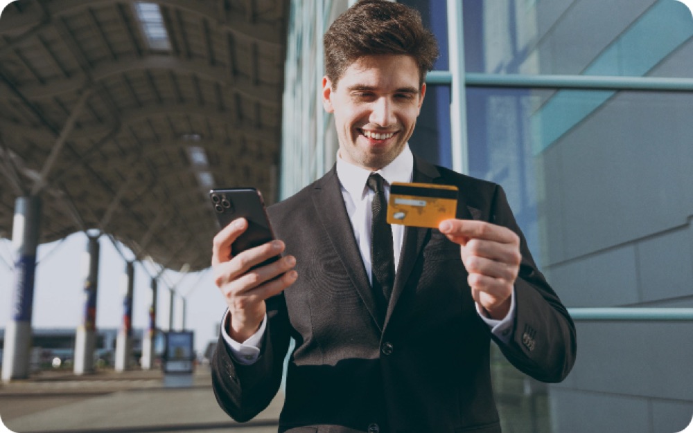 A man paying by card on his phone