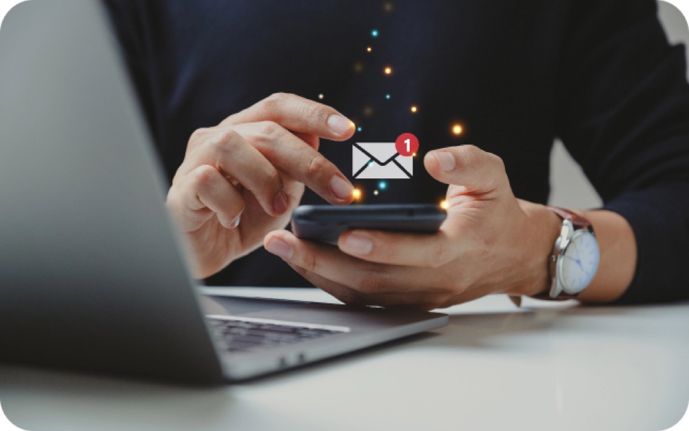 Hands typing a message on a phone